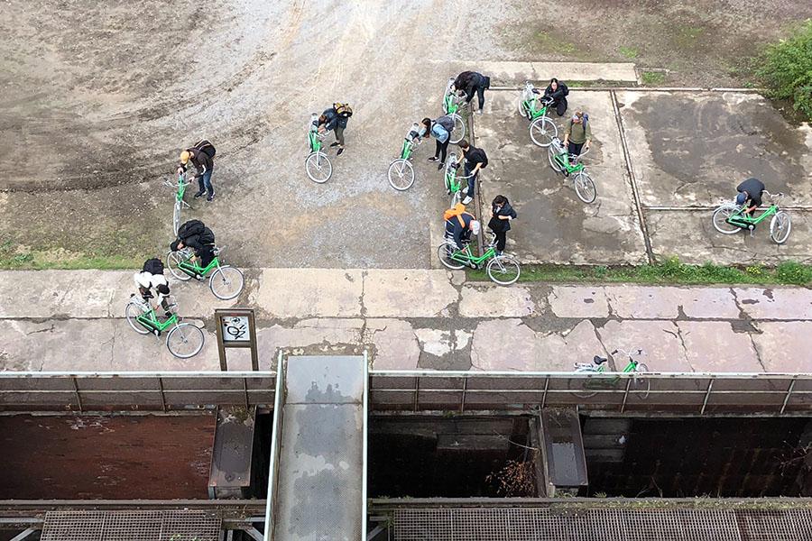 people on bicycles from above