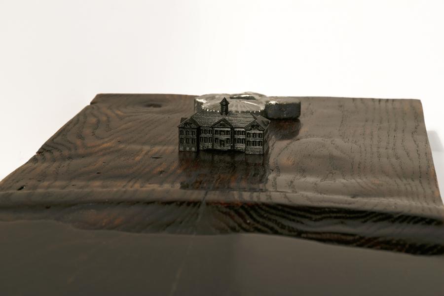Hand carved site model.