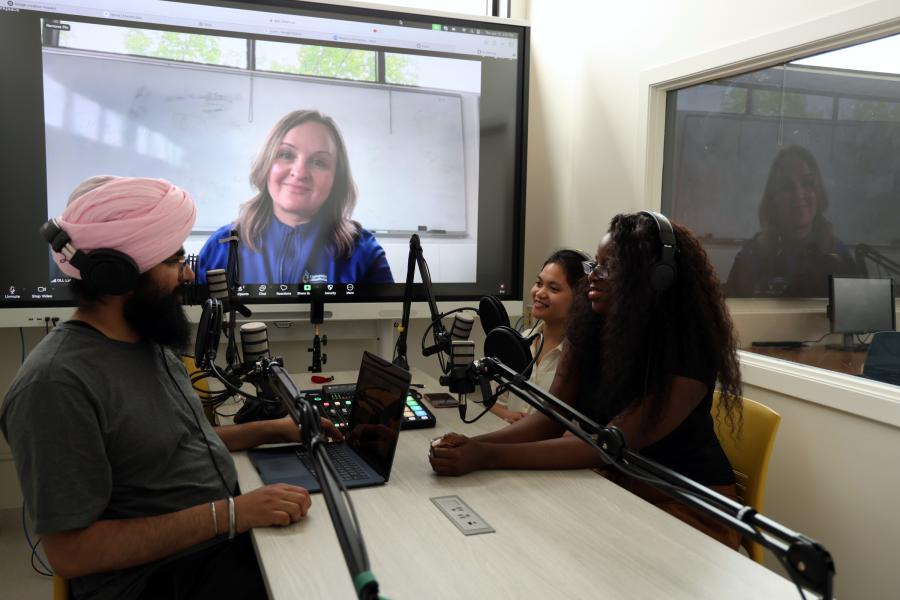 students sitting in podcast room