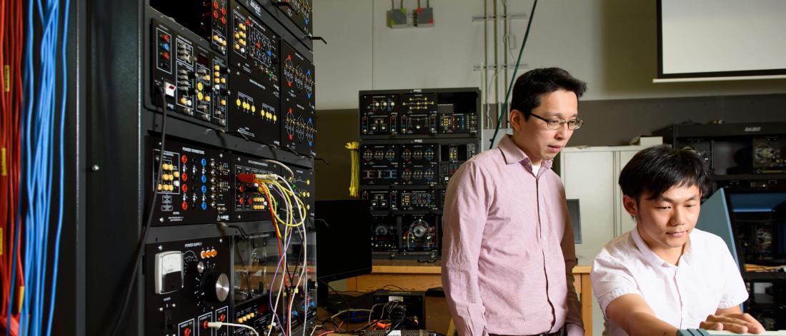 U of M researcher Carl Ho works in a lab.