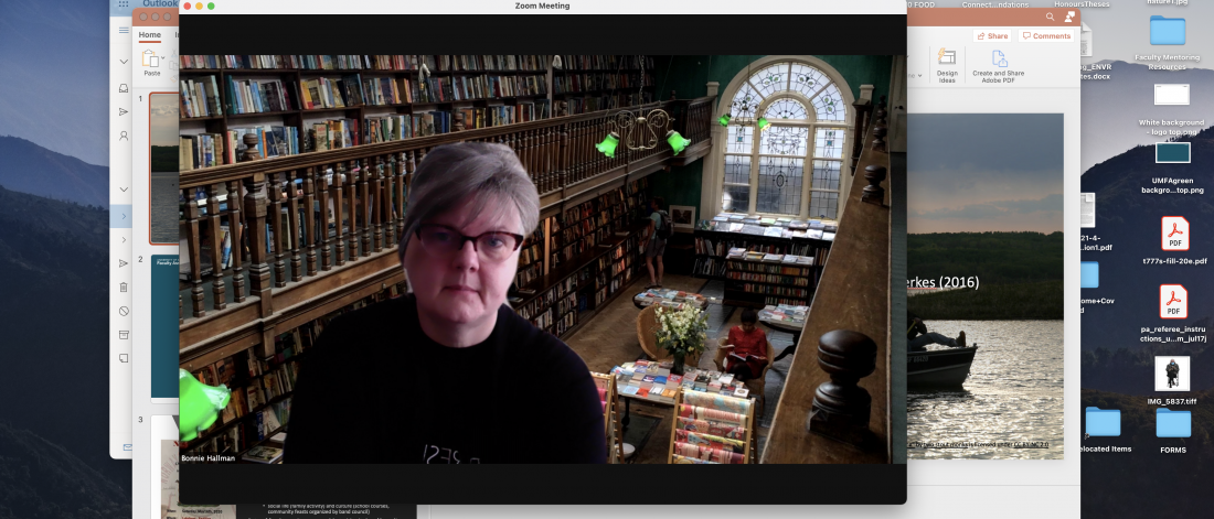 Doctor bonnie hallman standing in a library with many books behind her.