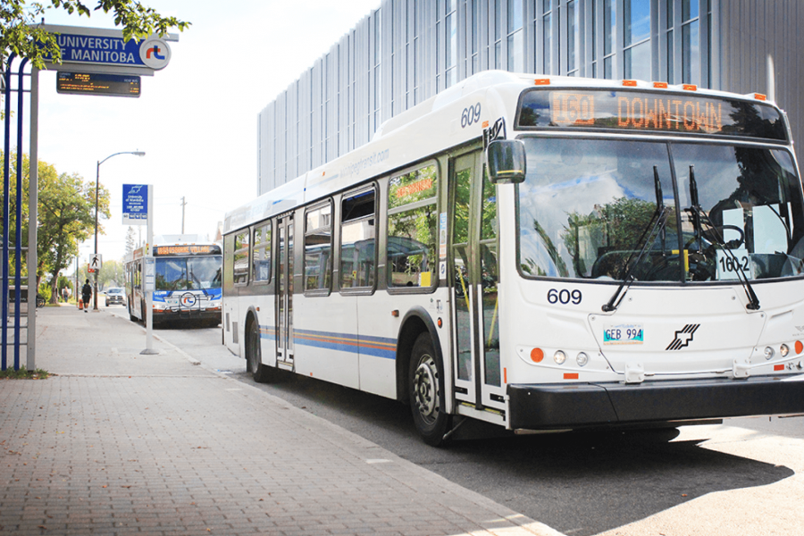A bus waits for passengers at the University of Manitoba Rapid Transit bus stop.