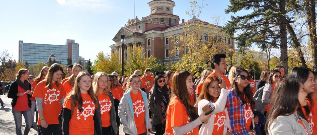 Participants in Orange Shirt Day march together at the University of Manitoba Fort Garry campus.