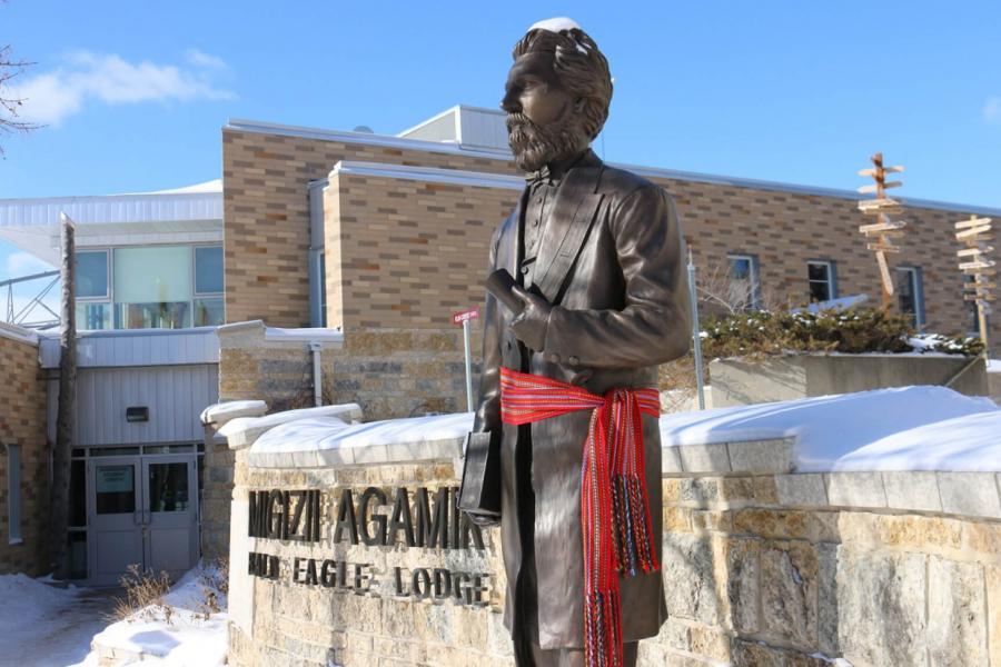Statue of Louis Riel wearing a Metis sash outside of Migizii Agamik - Bald Eagle Lodge.