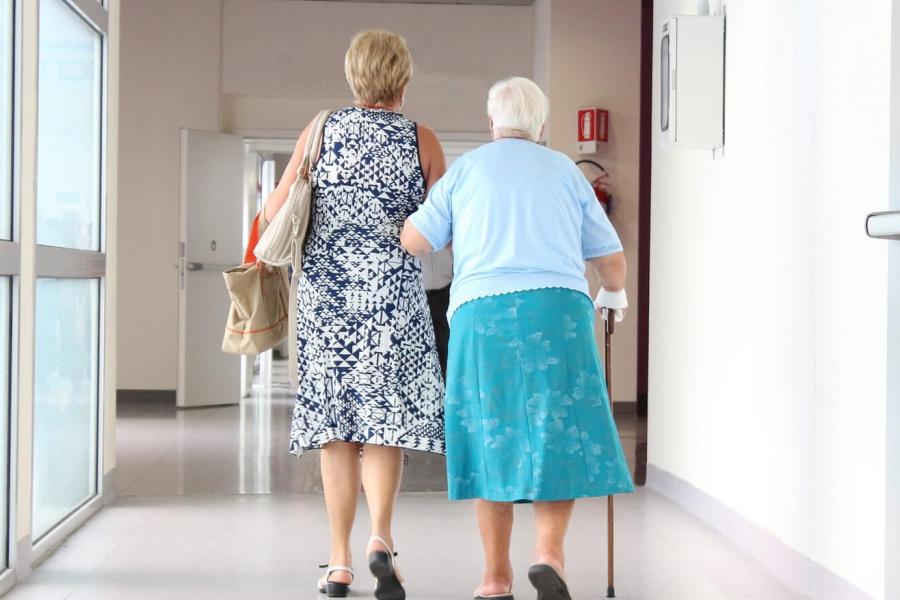 Seniors walking in a hospital.