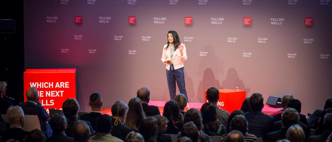 A woman presenting to an audience at Falling Walls Lab