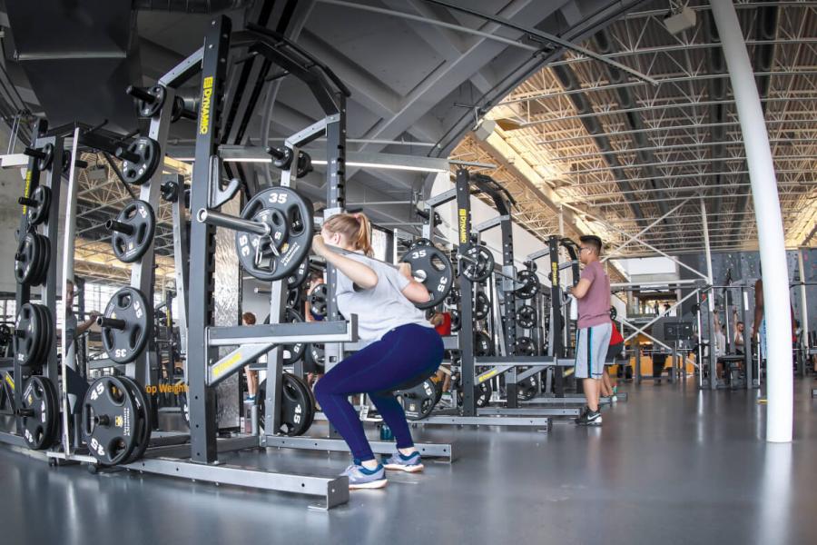 Woman lifting weights in the Active Living Centre