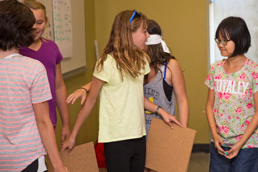 A group of junior science program participants talking.