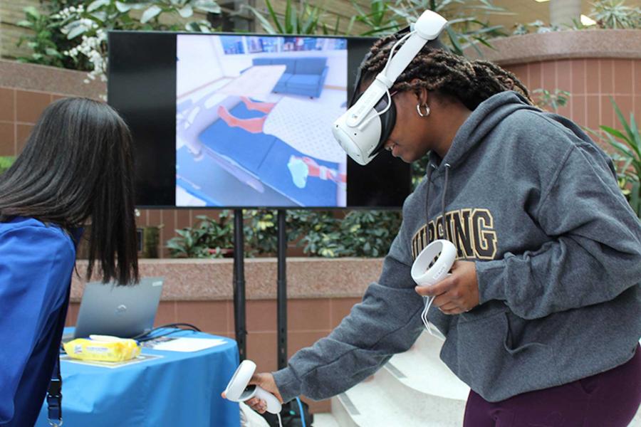 A UM nursing student tests the virtual reality nursing simulator.