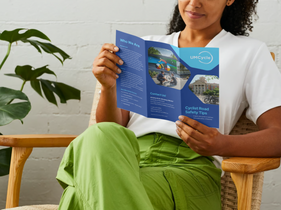 Photo of person holding bicycle brochure