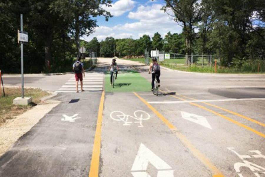 UM students using a pedestrian and cycling lane at the Fort Garry campus