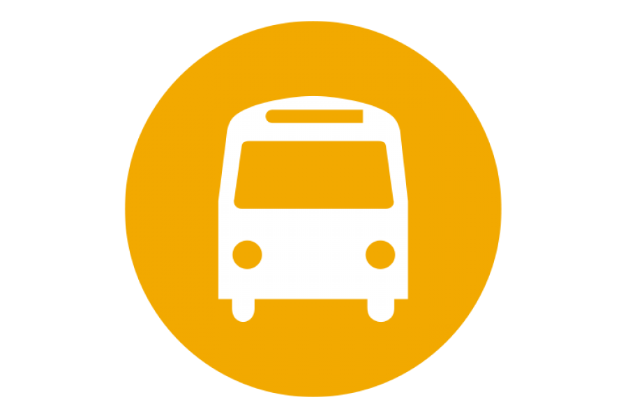 A graphic of a yellow circle with a white icon of a bus in the middle.