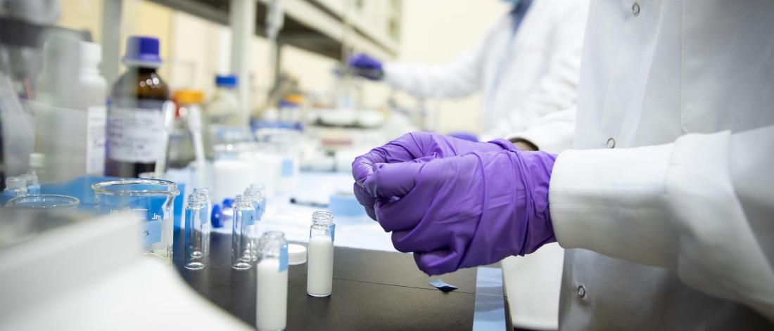 Researcher's gloves in lab