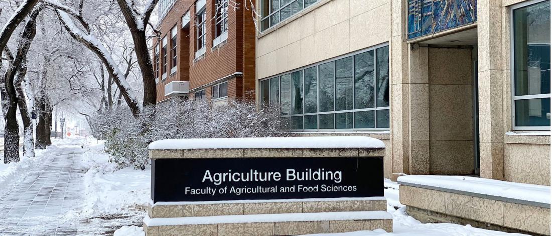 Agriculture Building sign covered in snow