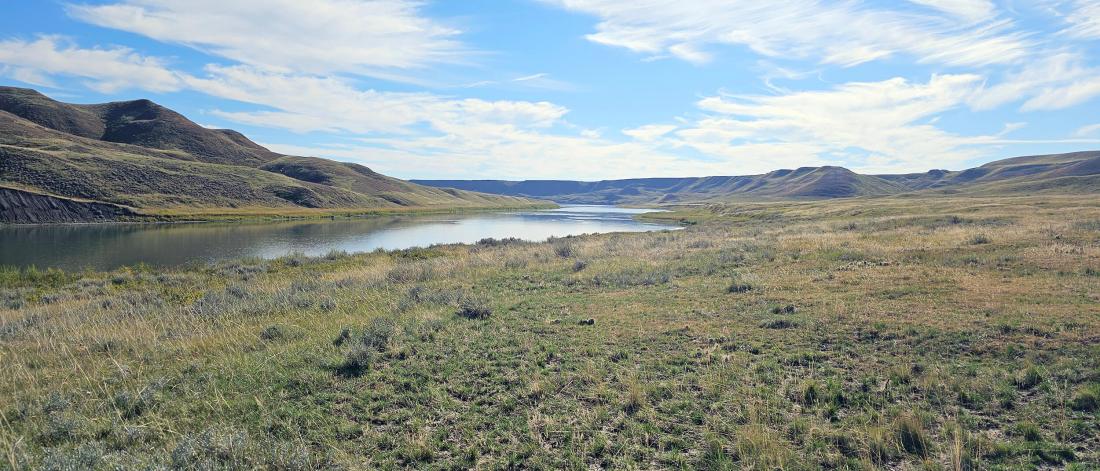 A river runs through the foothills