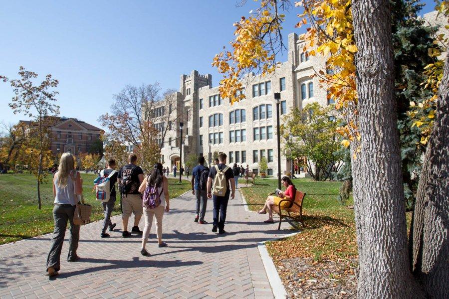Students walking towards a building on campus.