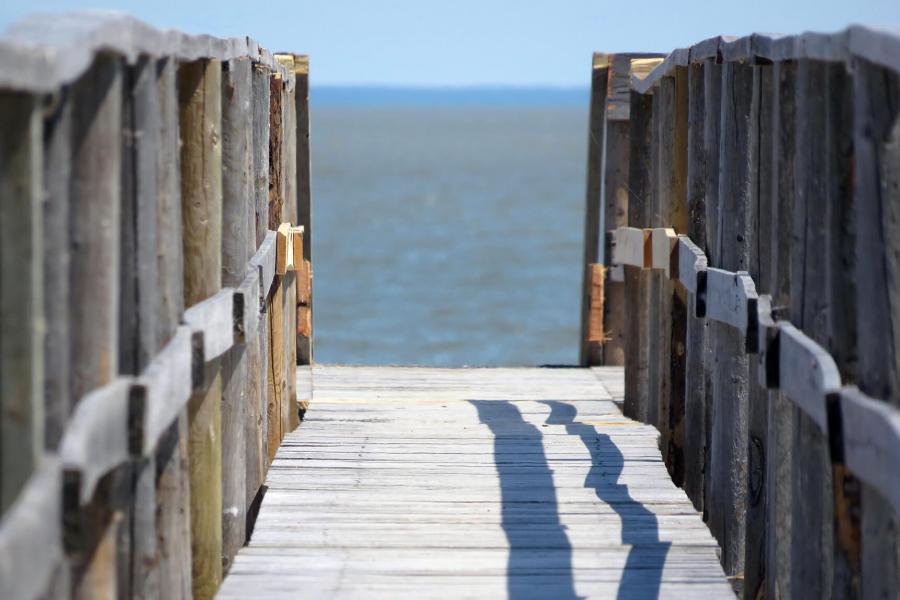 A dock leads to the waters of Lake Winnipeg