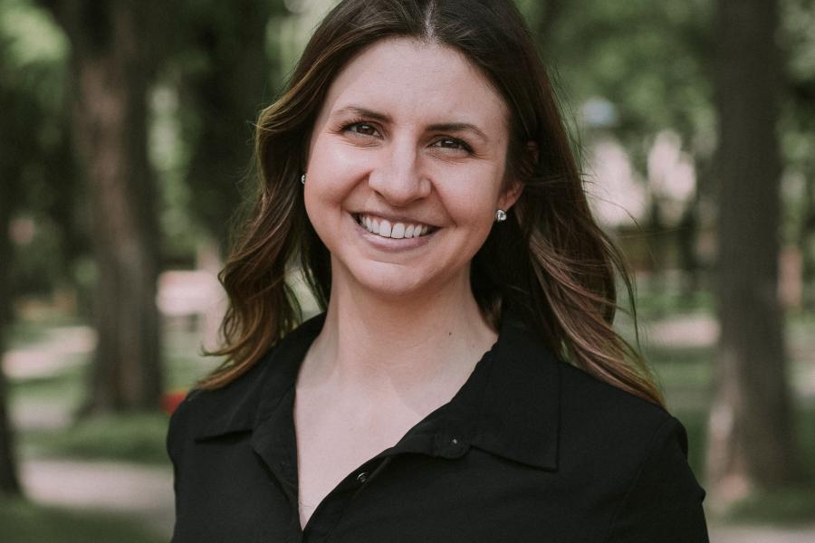 A headshot of Ashly Dyck in front of trees.