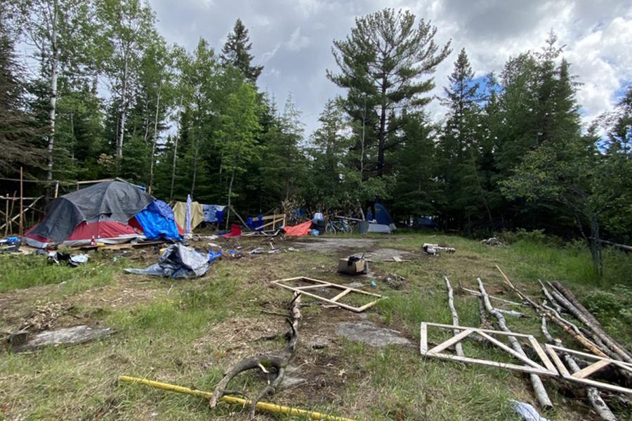 garbage and tents in a yard