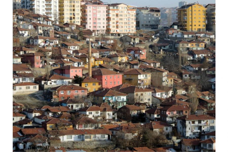 colourful houses built into the side of the mountain