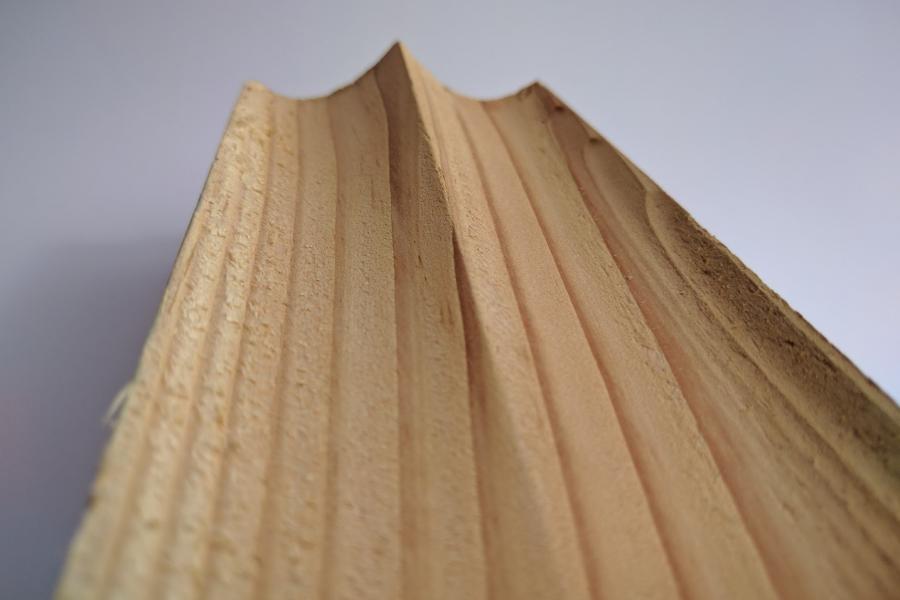 Detail of carved wood and grain.