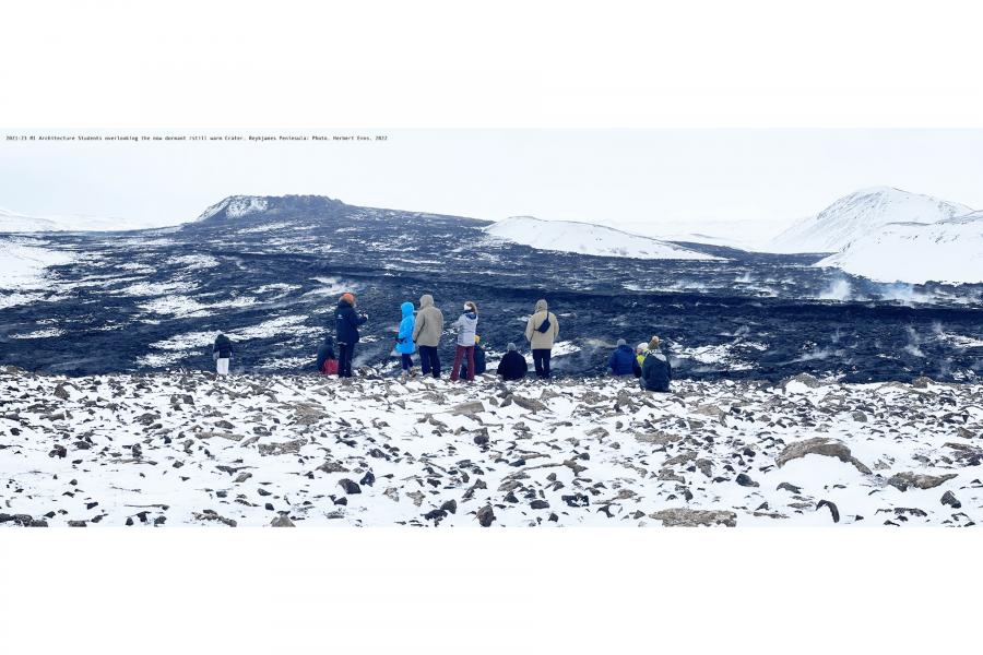 Students walk across snowy hill