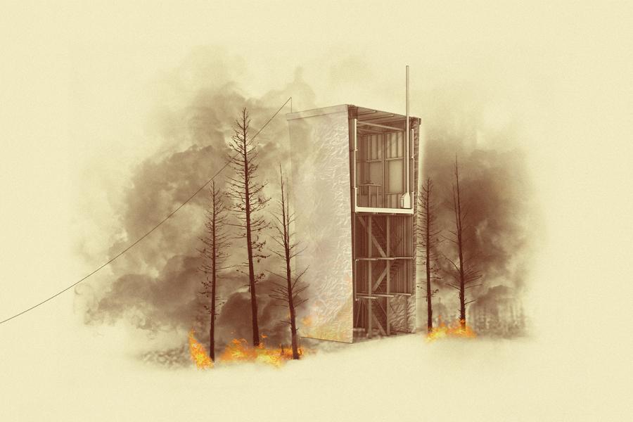 The  new watch tower with a whole building fire blanket deployed during a wildfire.