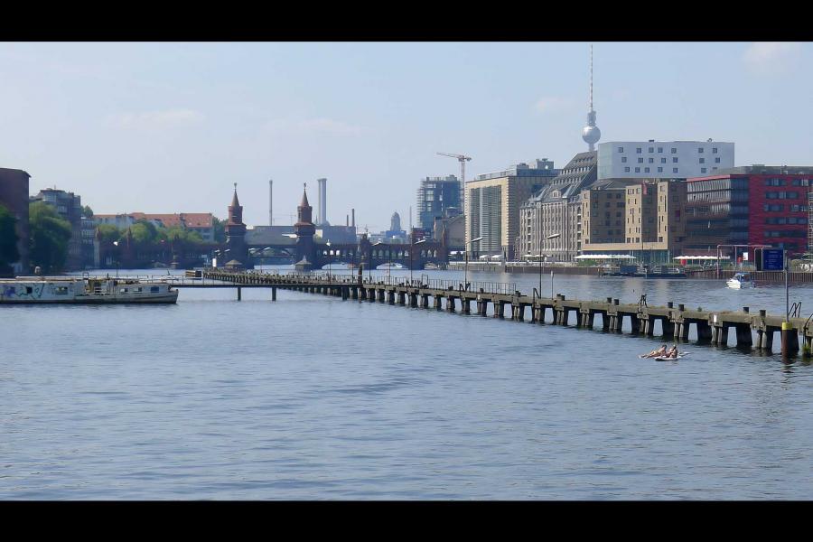 The Spree River in Berlin showing the Oberbaum Bridge in the background.