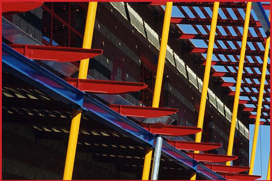 exterior view of building steel beams colored red, yellow and blue