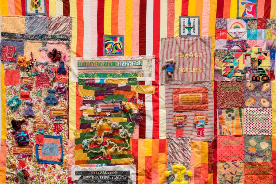 colorful quilt with multiple paterns and textures