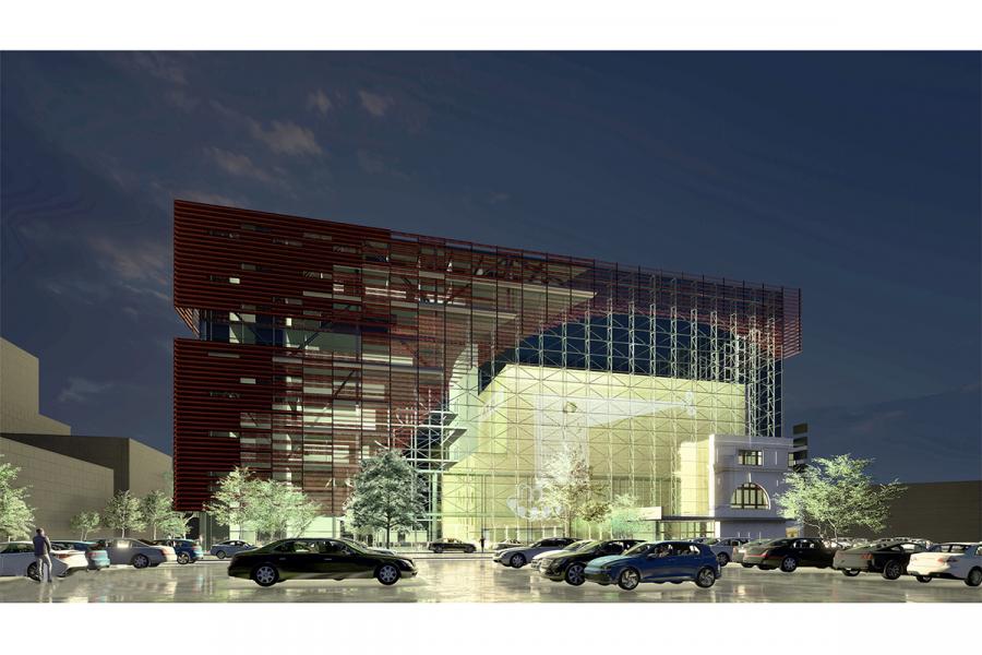 A building with a large parking lot in front