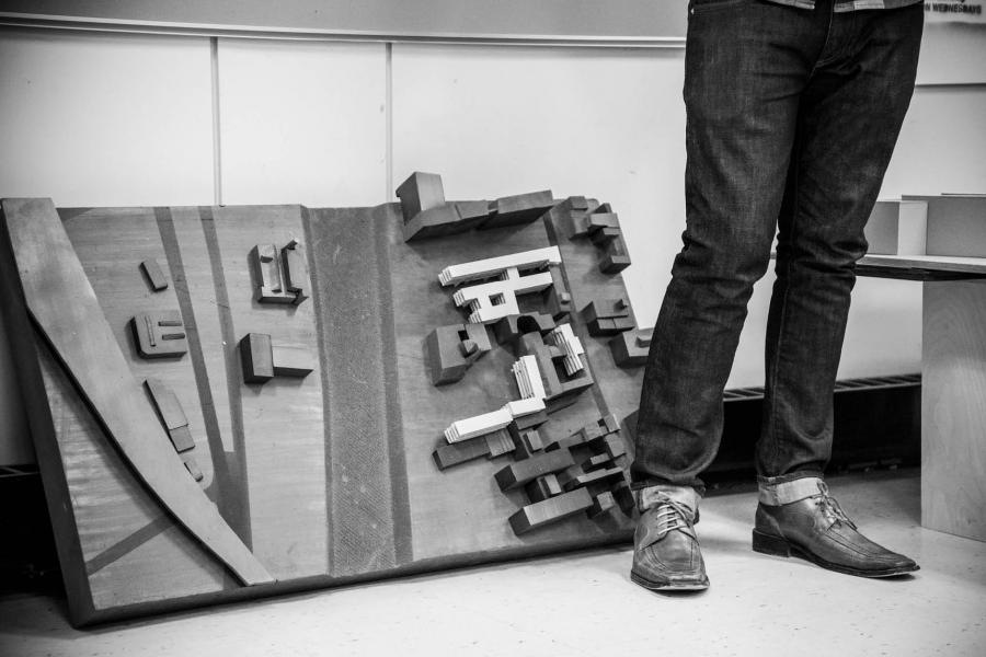 architectural model leaned up against a wall