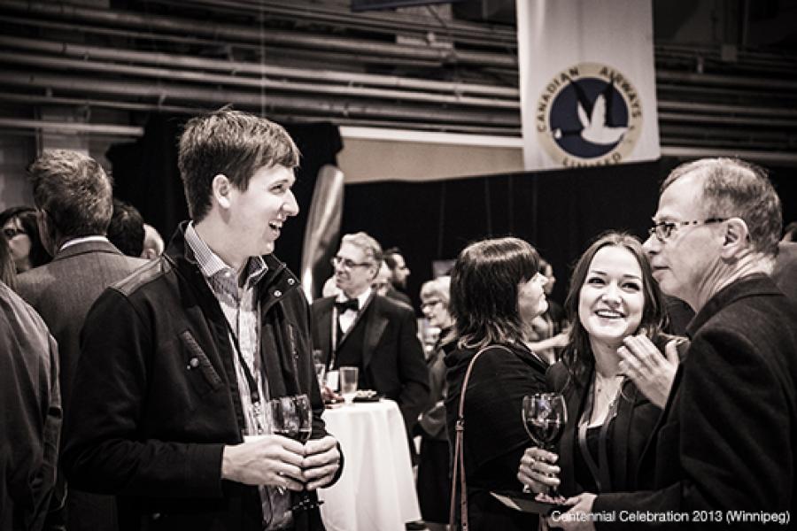 People gather and socialize at an event 