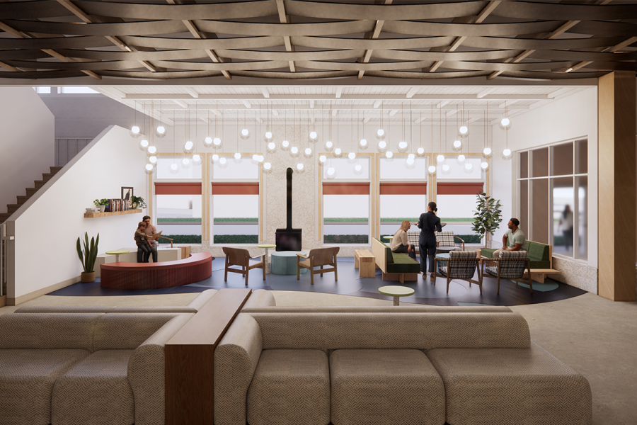 A modern lobby of a building featuring sleek design, elegant furnishings, and ample natural light streaming through large windows.