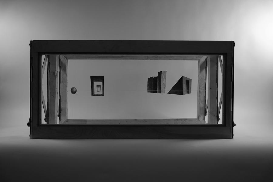 The drawing showcases multiple chair perspectives, including side, front, and top views, with precise lines and perspective details. It emphasizes the chair's geometric form against a light brown background.