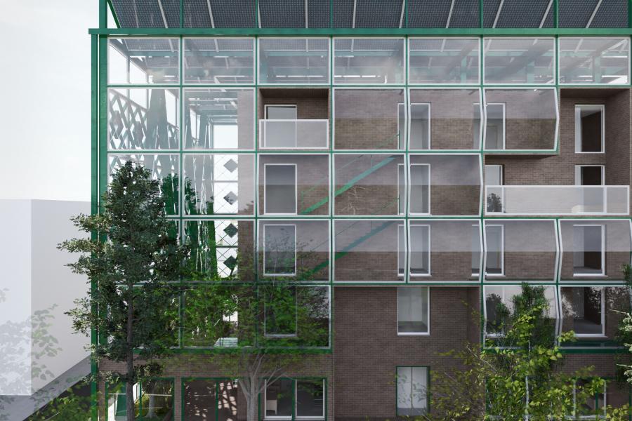 Green-framed modern building with large glass windows and brick walls, surrounded by trees. The rooftop features solar panels, creating an eco-friendly vibe.