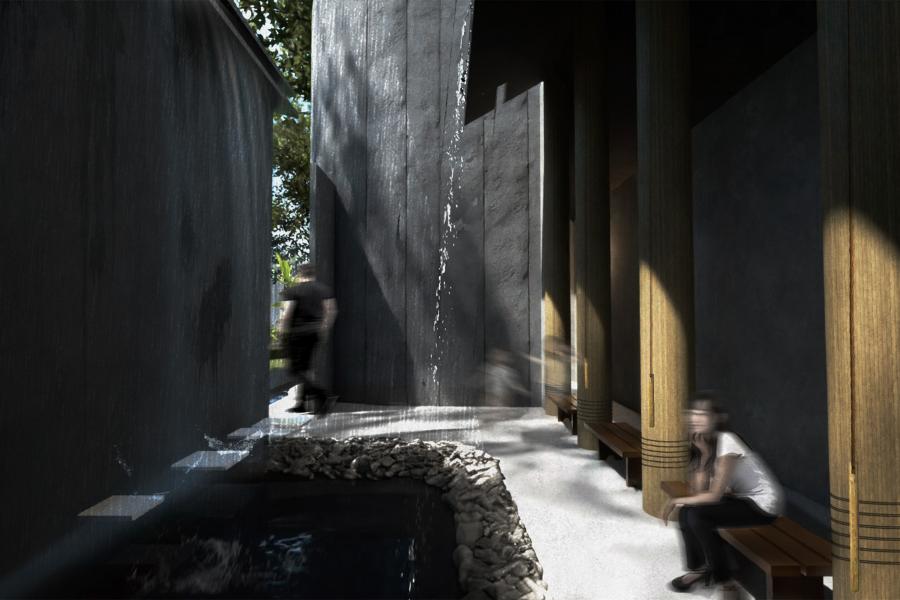 A serene courtyard with dark stone walls, flowing water, a small pond, and wooden benches. Sunlight casts gentle shadows, creating a calm ambiance.