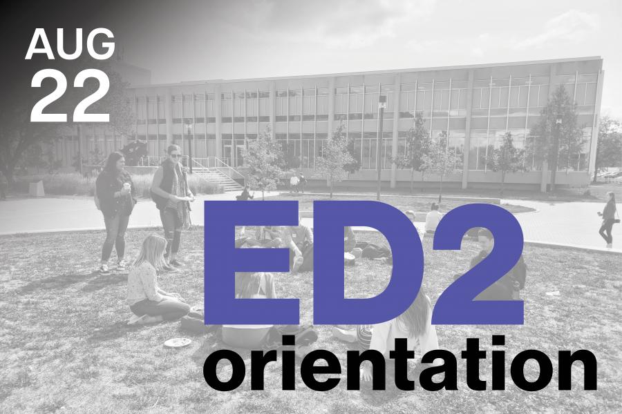 Black and white image of students sitting on grass outside a modern building.