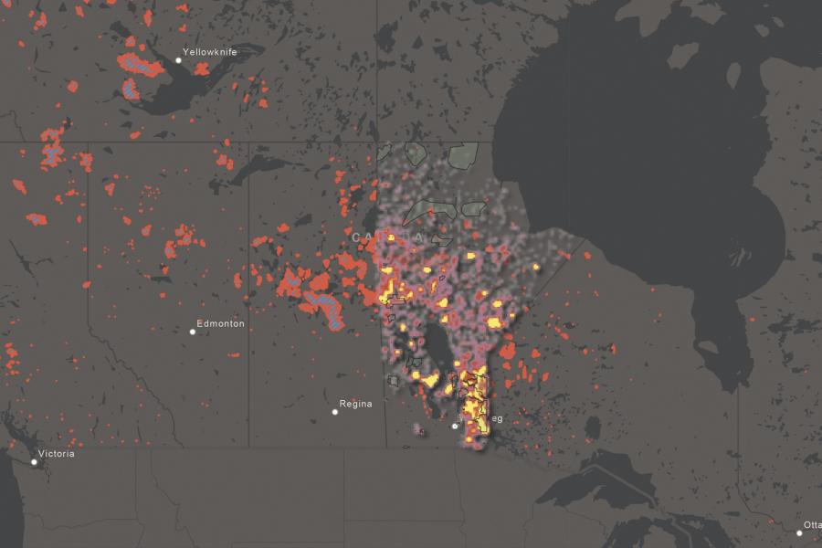 Map showing wildfires in Canada with red and orange markers indicating fire intensity.