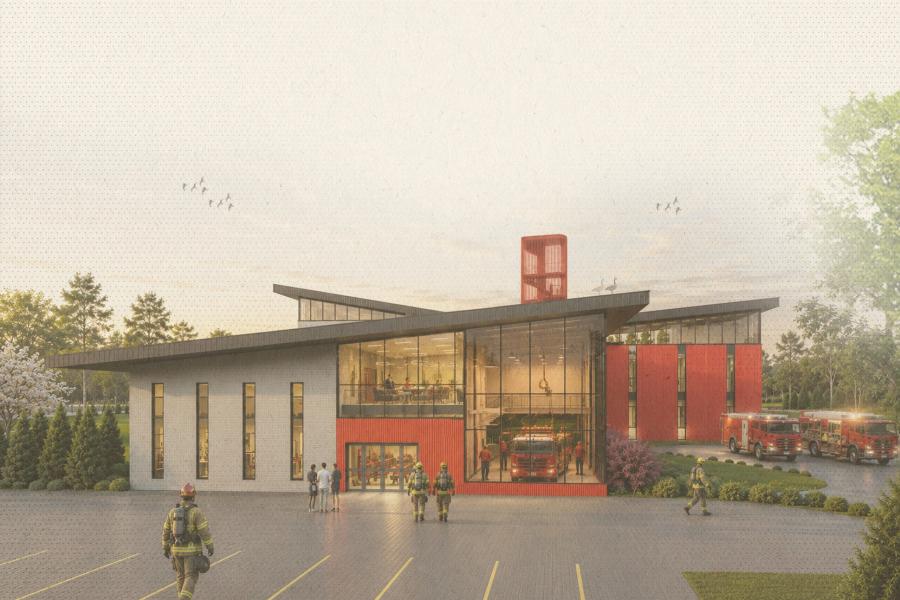 Exterior rendering of a modern fire station with large glass windows, angular roof, and red accent walls.