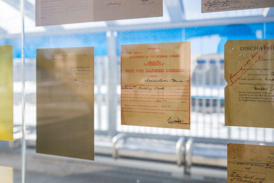 A glass display showcases several historical documents.