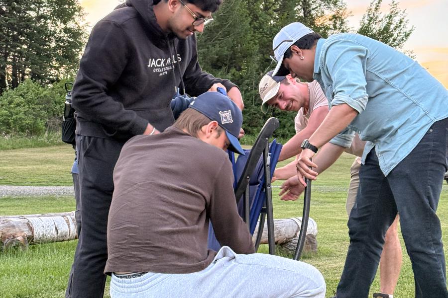 team of people working to constuct a table