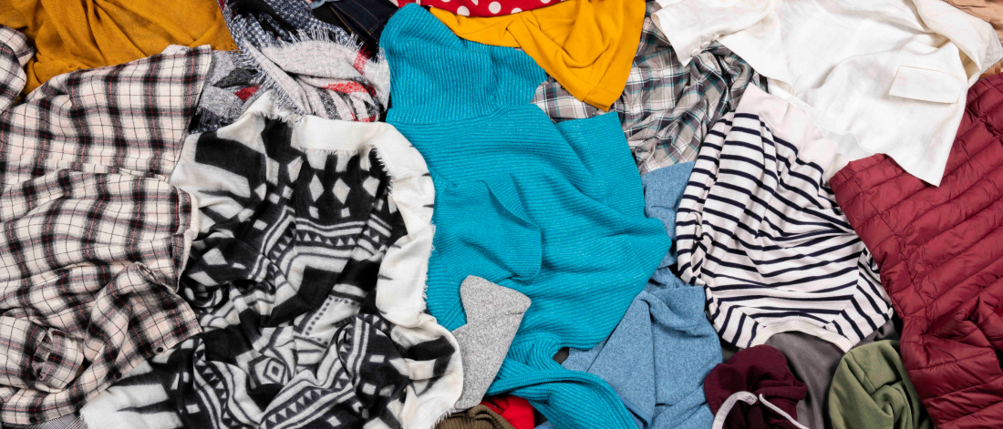 Colourful clothes crumpled in a pile filling the image space.