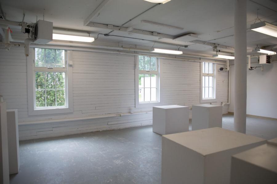 A studio space within the Art Barn painted completely white. 