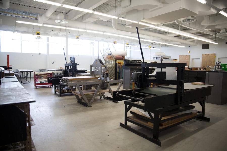 The print media room with several pieces of equipment for varying types of printing. 