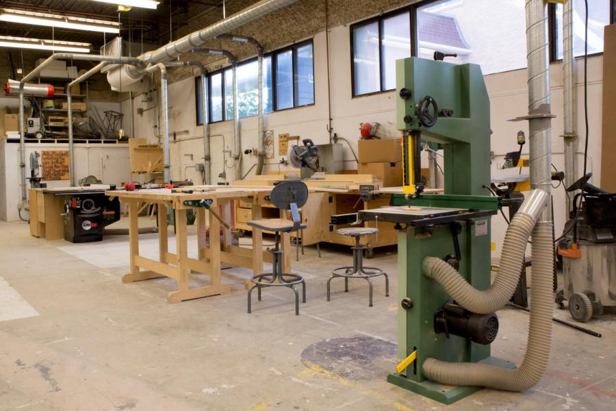 Interior view of the sculpture building with various pieces of equipment placed around the room.