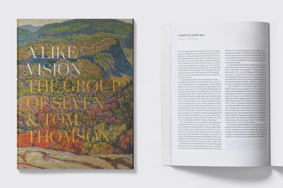 Book cover reading "A Like Vision - The Group of Seven and Tom Thomson" beside an open book with article text too small to read.