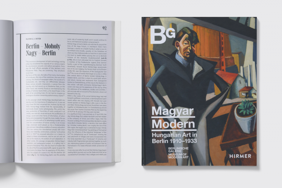 Book cover reading "Magyar Modern, Hungarian Art in Berlin 1910-1933" beside an open book with article text too small to read.