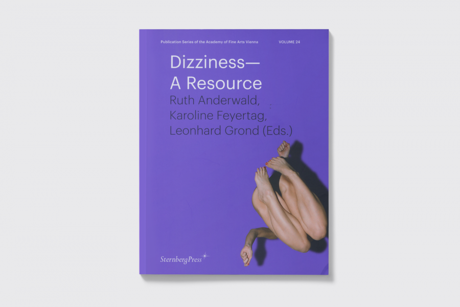 Book cover reading " Dizziness A Resource" beside an open book with article text too small to read.