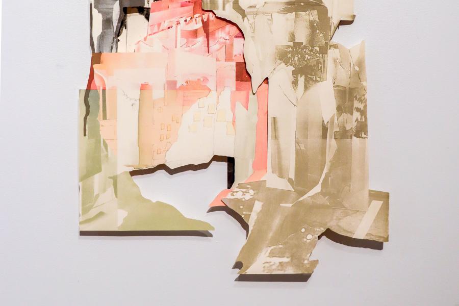 A fragmented collage with layers of sepia-toned and pastel-colored paper creating an abstract architectural composition.